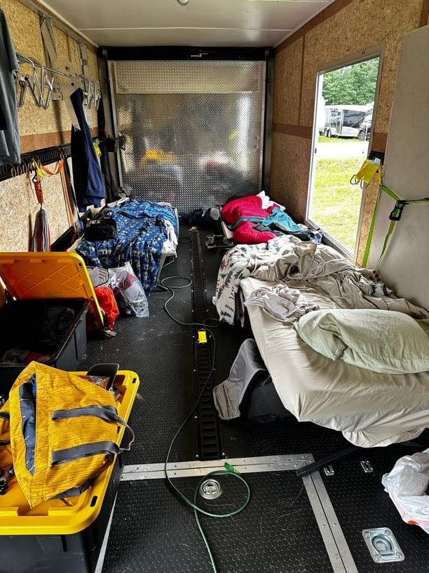 By night, the enclosed trailer became a compact three-person bunkhouse.