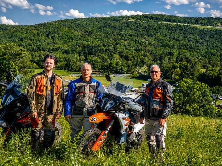 Brett, Andrew, and Max above Fowler Grove—the portrait that became the trip's signature.