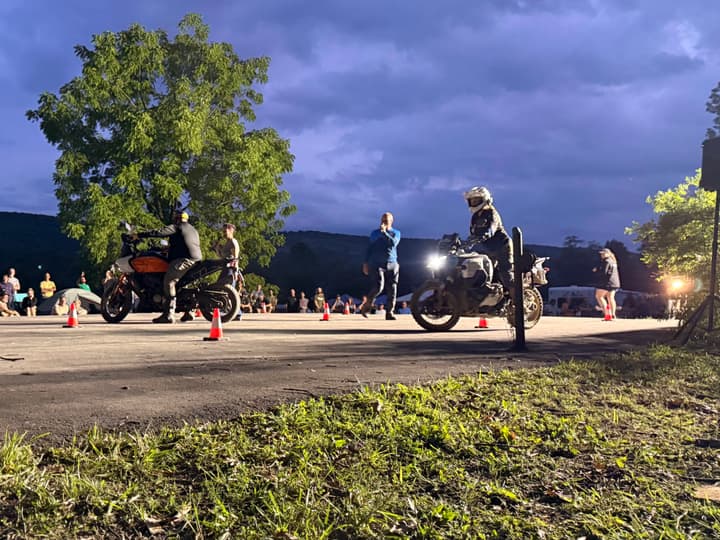Slow races after sunset: balance, laughter, and a crowd willing everyone to stay upright.